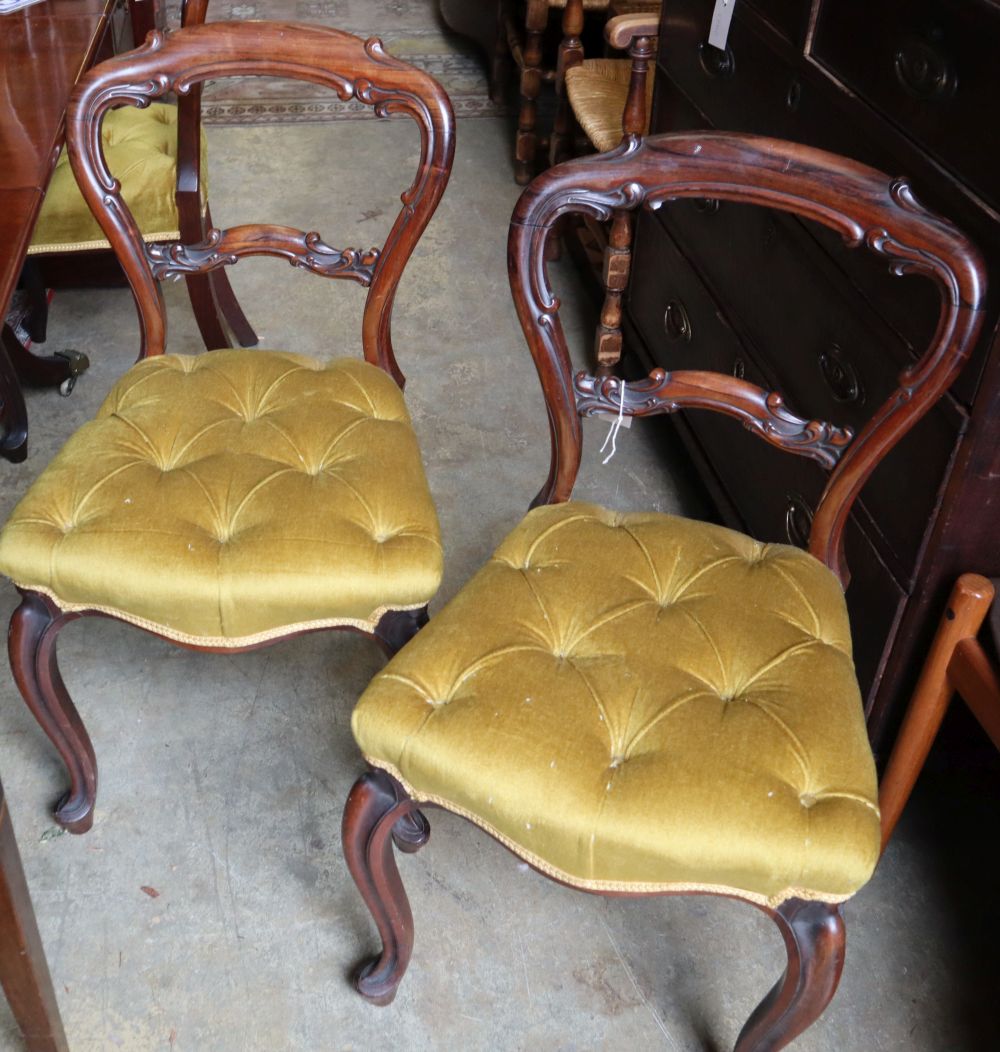 A set of six mid Victorian rosewood balloon back dining chairs with buttoned gold dralon seats